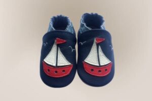 Blue and white leather baby shoe with suede sole and ship design