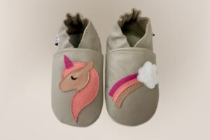 Brown leather baby shoe with suede sole and unicorn design